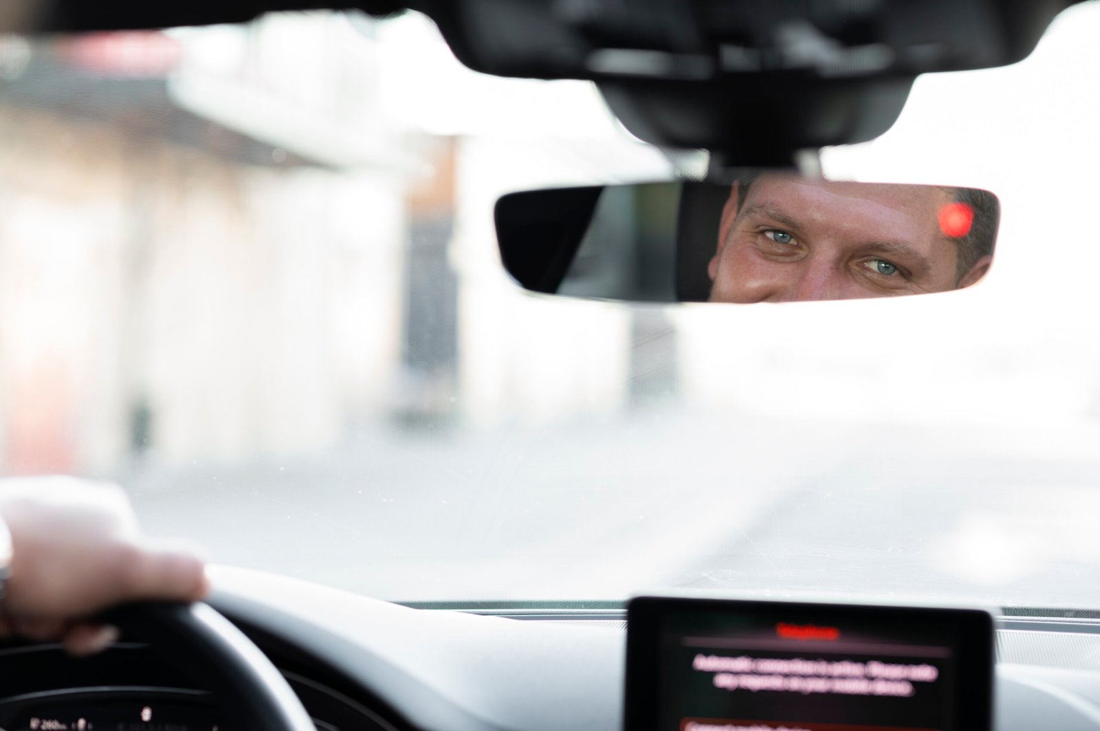 driver looking car mirror scaled