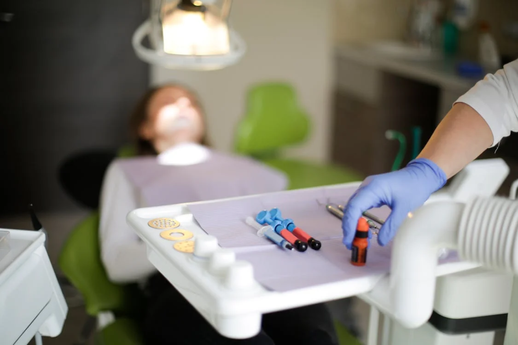 Dentist using tools during a dental surgery