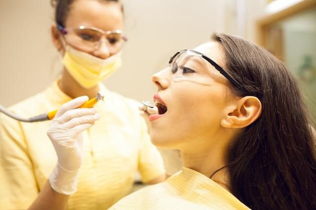 A woman going through a dental checkup