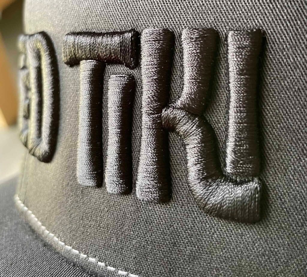 Close-up of a 3D Puff Embroidery design on a cap.