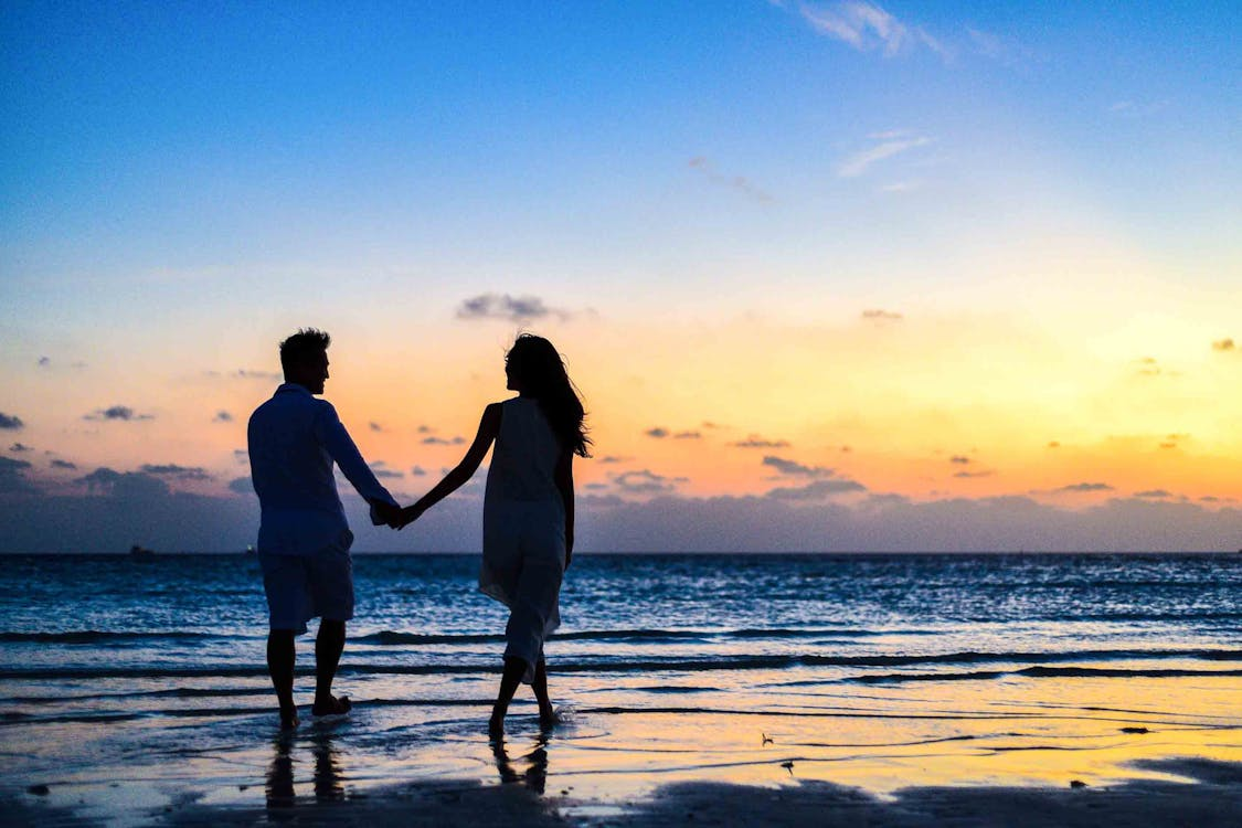 A couple walking on the beach