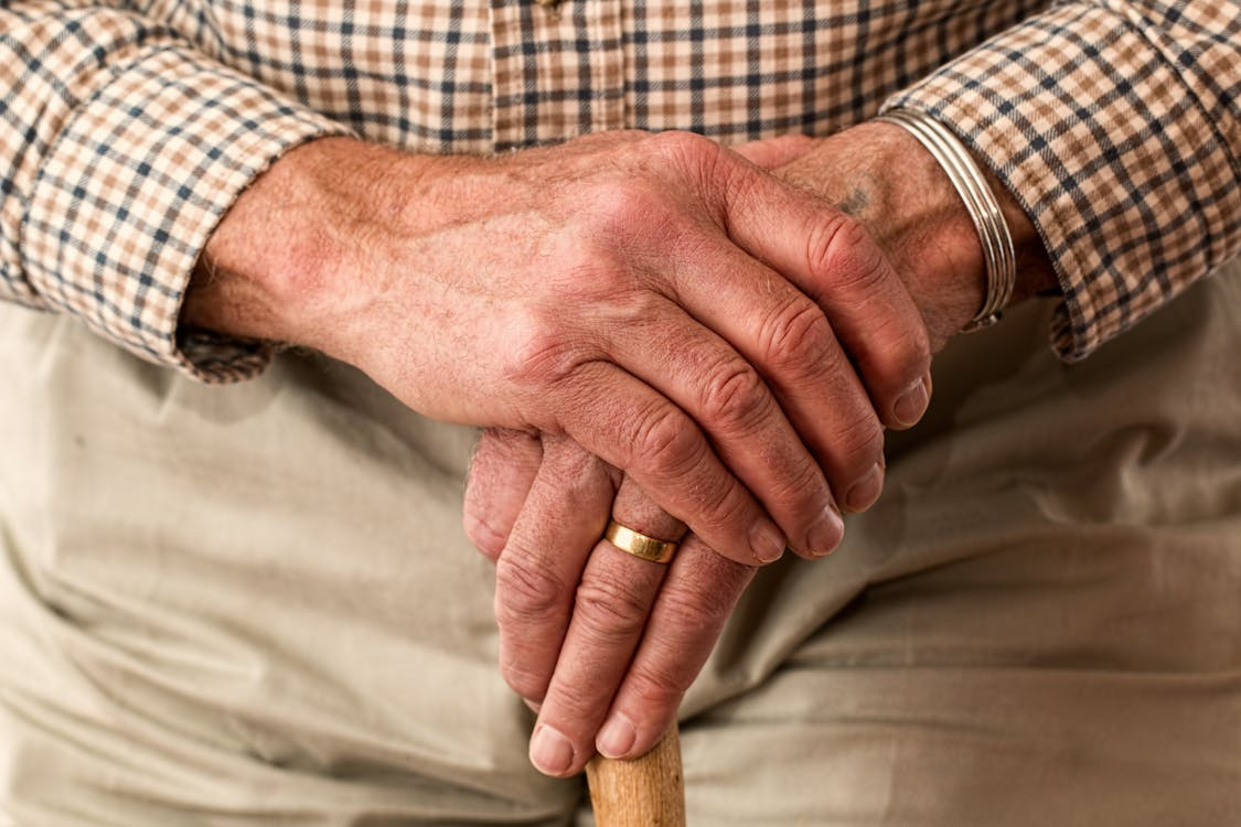 A man holding a walking stick