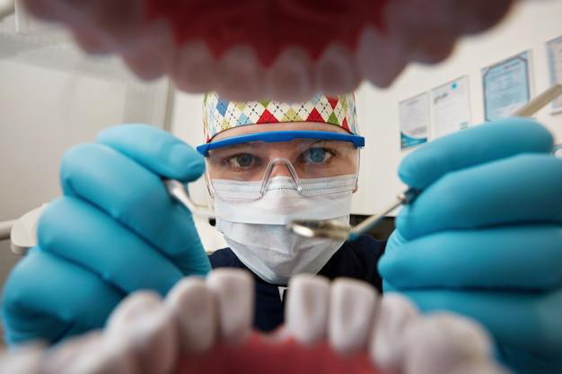 A dentist examining a patient's mouth with care, demonstrating anxiety-free dentistry techniques.