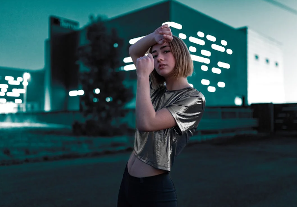 girl standing on a roof