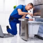 Service technician refrigerator appliance repair