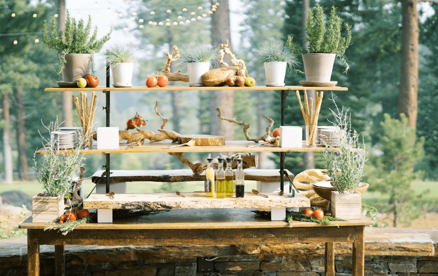 A wooden table with sauces and plants on it