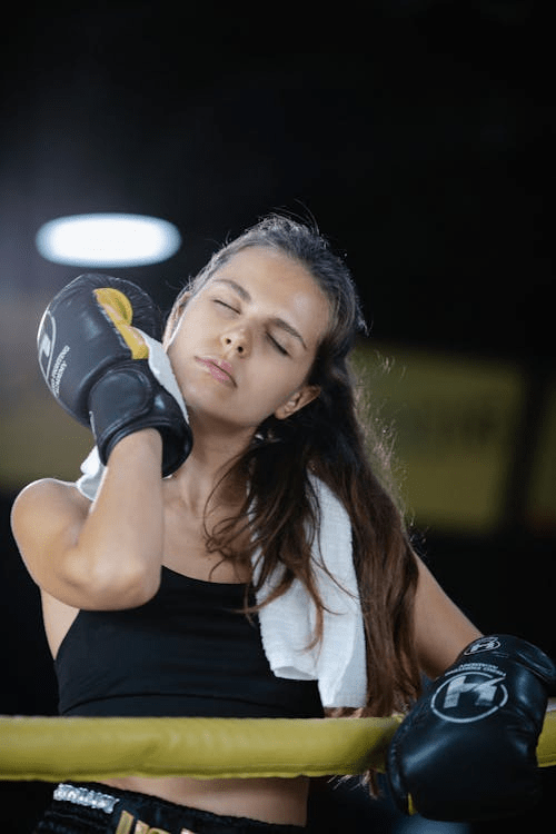 A woman wearing boxing gloves