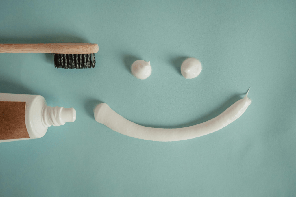 A picture of a toothpaste and a toothbrush