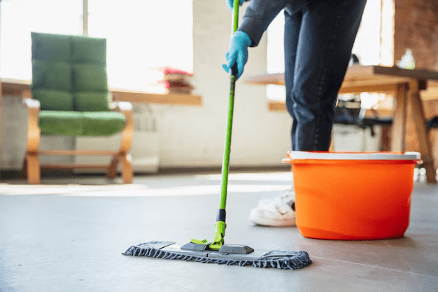 A person mopping a floor