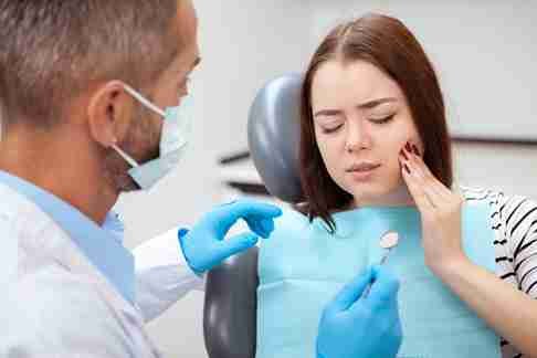 a women have toothache so checkup of woman