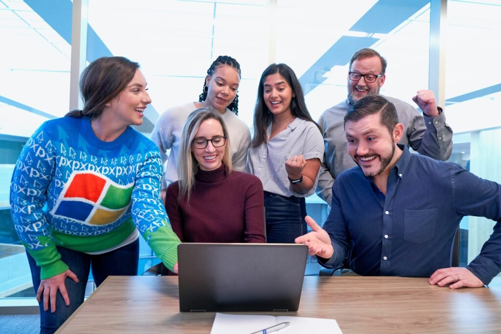 Employees looking at computer.